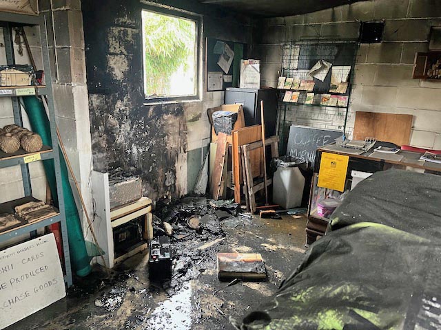 Photo showing the fire damage at the eastney and Milton allotments shop.